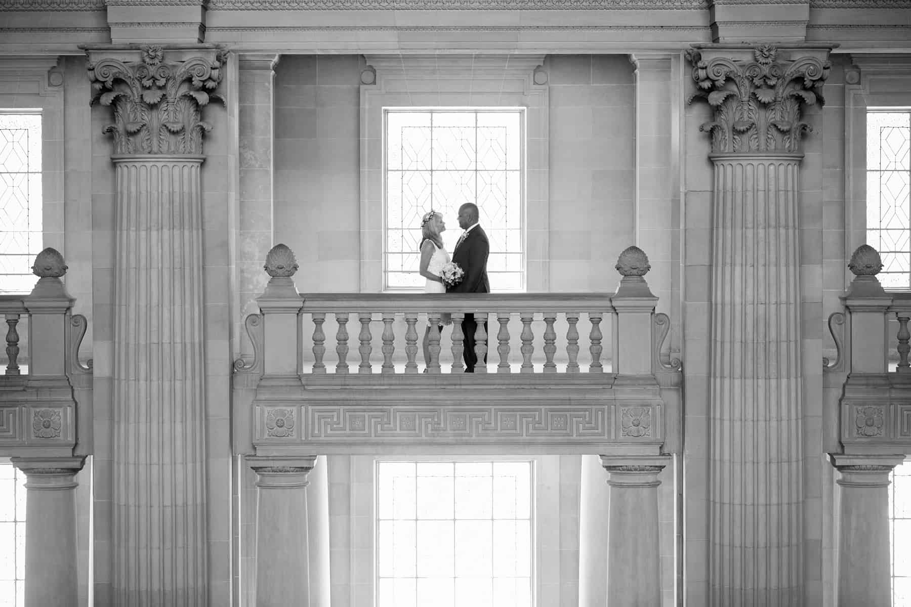dramatic shot of married couple at San Francisco City Hall