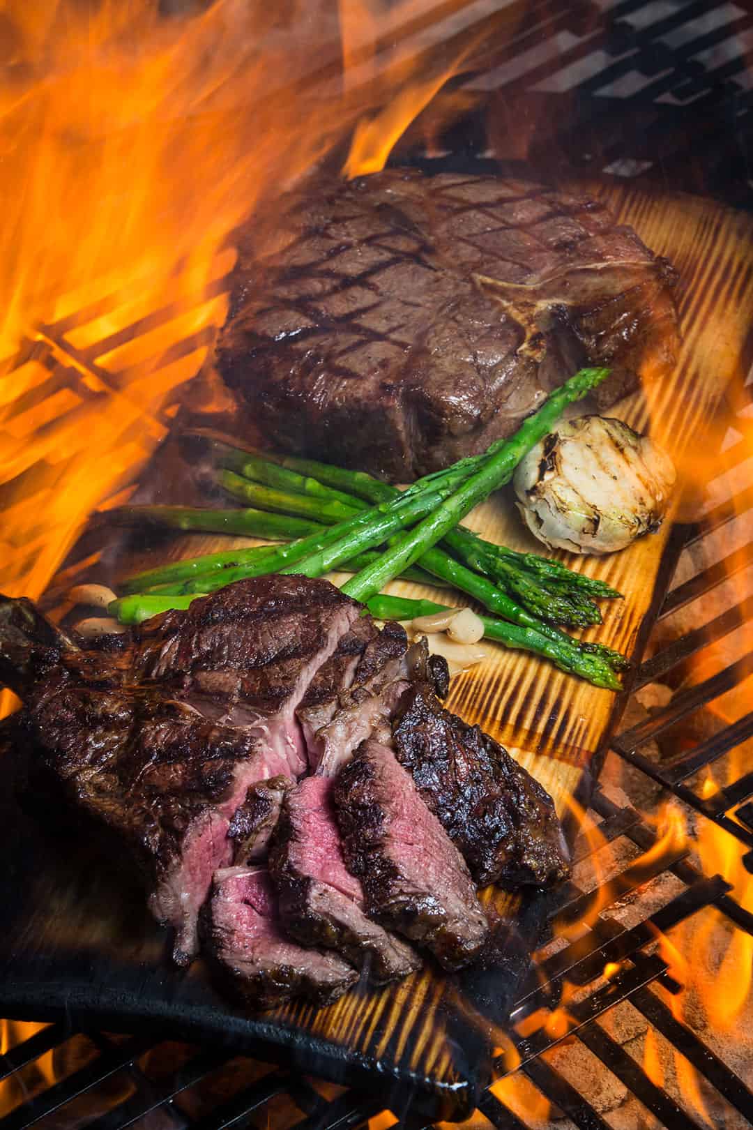 steak on a fiery grill